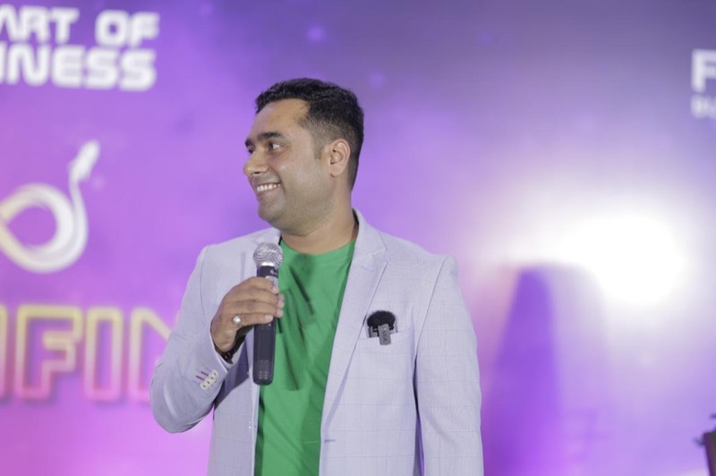 Ujjwal Abhishek speaking on stage
